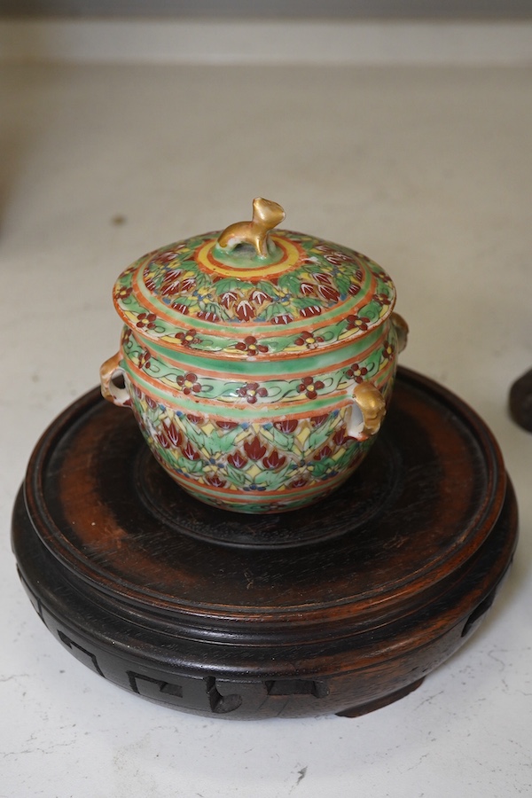 A Chinese celadon glazed vase, marble inset hardwood stand, 18th century Chinese Export blue and white plate, pot and cover and a circular wood stand, tallest 20cm. Condition - fair to good